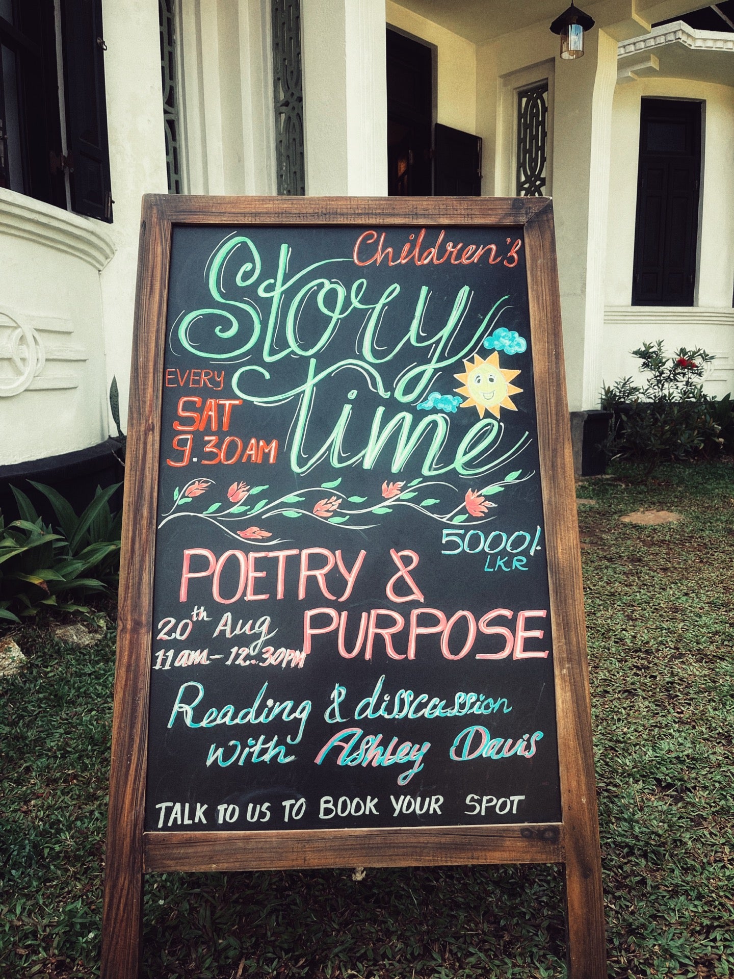 A chalk signboard advertising storytime for children at Wild & the Sage bookshop in Galle, Sri Lanka